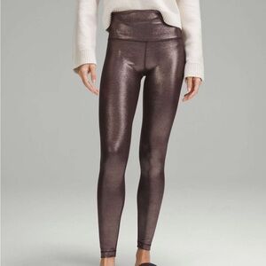 Lululemon copperShiny Metallic Leggings
Never worn high waisted 4 full length